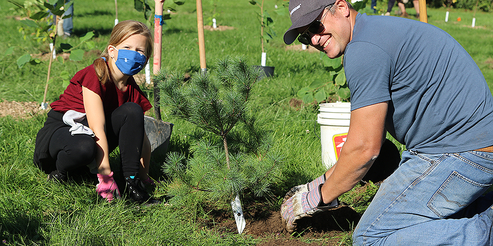 Dad & daughter planting