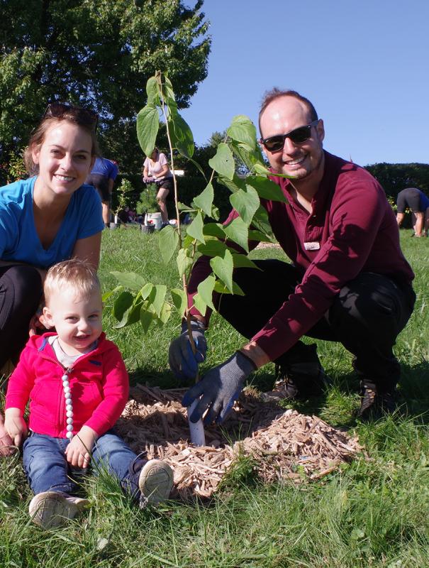 Family planting trees