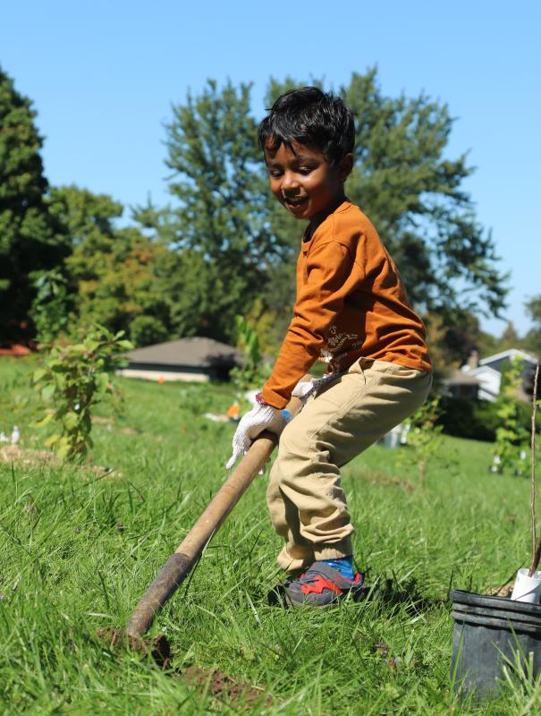 Boy planting at Arthur Ford Park