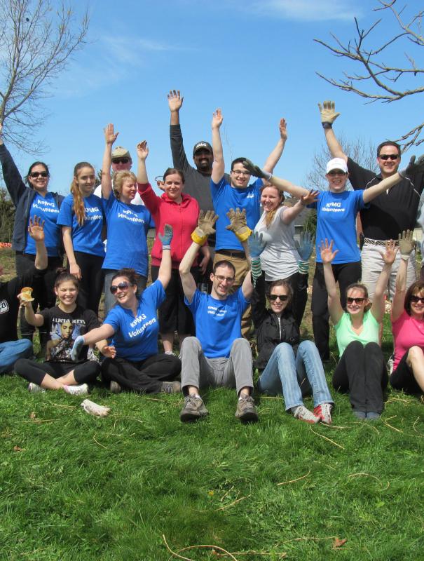 KPMG group celebrating being outside volunteering