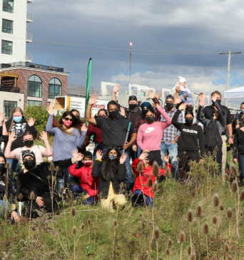 Image of ReForest London staff and Harvey's staff in a group photo together at a planting event.